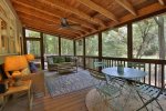 Seating and dinning on screened in porch